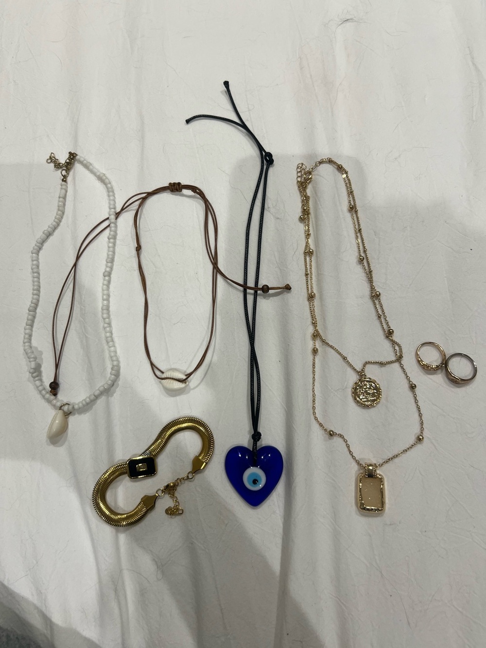 Assortment of necklaces/rings